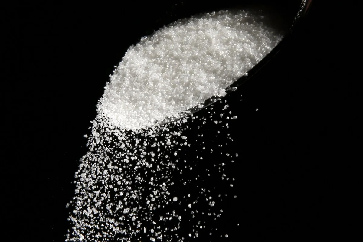 Granulated sugar is poured using a spoon in Philadelphia, Pa., on Sept. 12, 2016. (Matt Rourke/AP Photo)