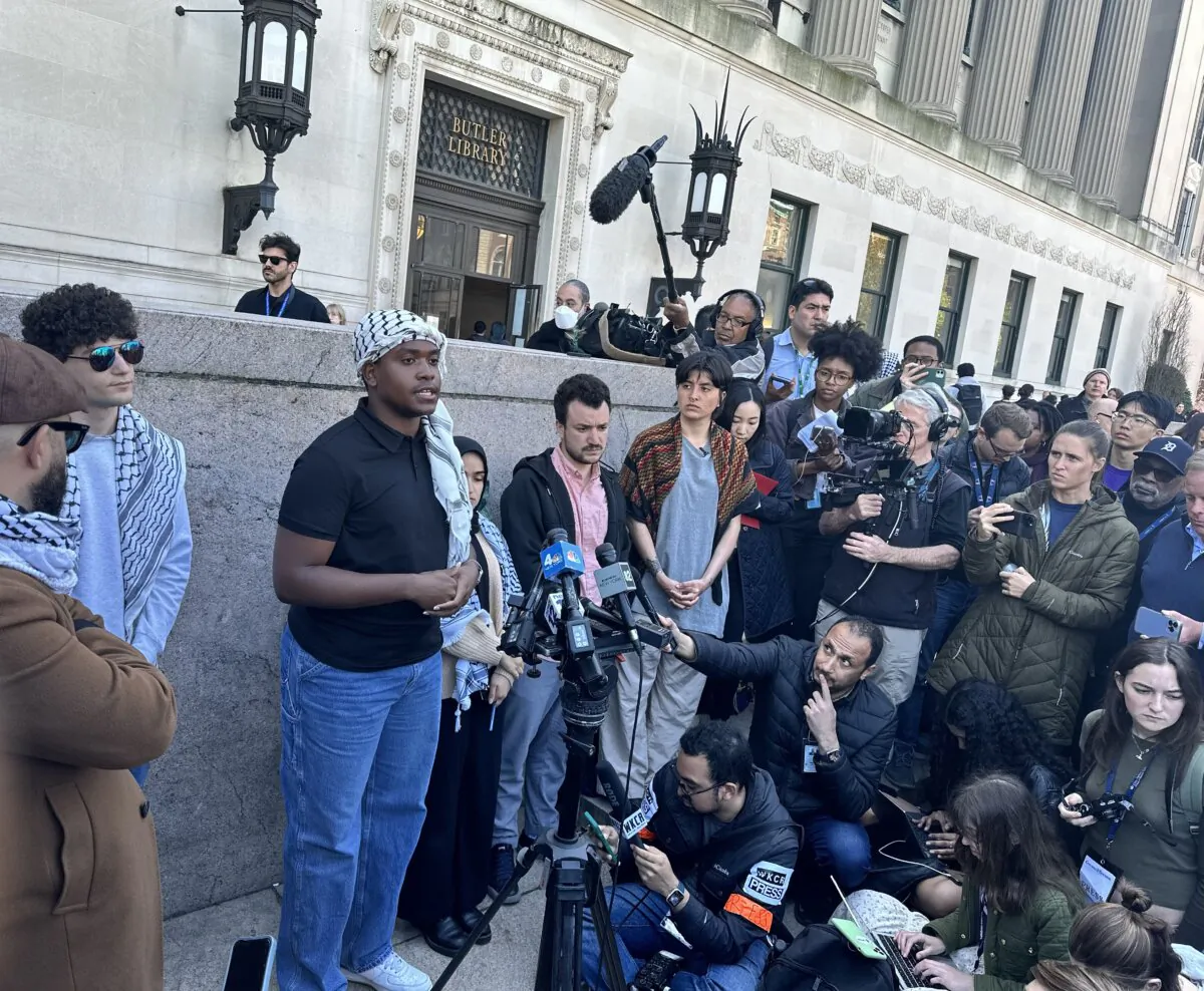 Encampment member and spokesperson Khymani James (wearing Palestinian keffiyeh head scarf) addresses the media on April 25, 2024 at the Columbia University encampment. (Juliette Fairley/The Epoch Times)