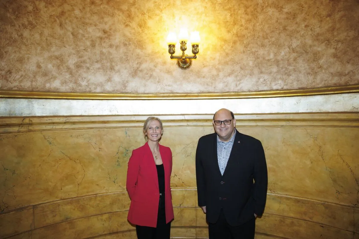Theatre producer Michael Rubinoff poses alongside Tim Hortons executive Hope Bagozzi at the Elgin Theatre in Toronto, April 9, 2024. (The Canadian Press/Cole Burston)