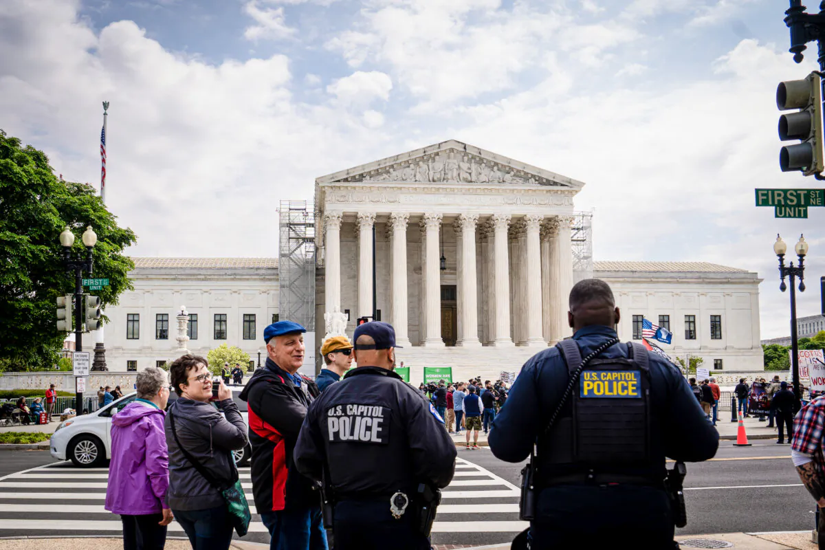Protestors in front of the Supreme Court in Washington on April 25, 2024. (Madalina Vasiliu/The Epoch Times)