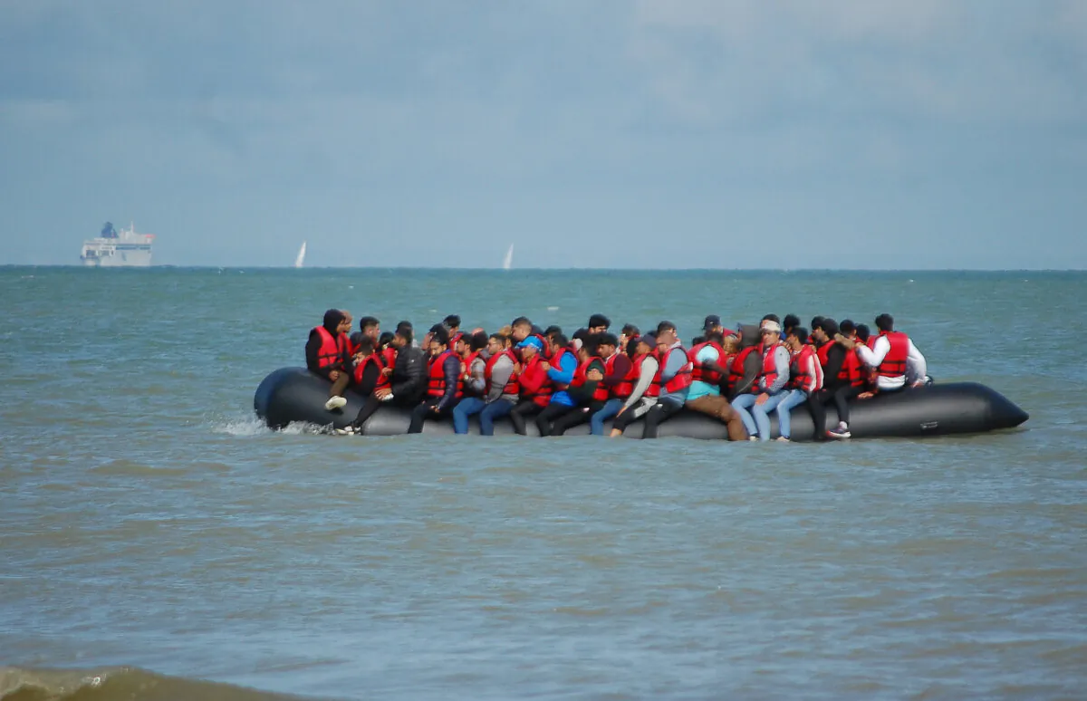 The UK’s ‘Rwanda Plan’ could serve as a model for the United States as both countries struggle to stem illegal immigration. Immigrants should be deported or sent to a safe third country to await the processing of their asylum claims. Pictured: Illegal immigrants sit on an inflatable raft before attempting to illegally cross the English Channel to reach Britain, off the coast of Sangatte, France, on July 18, 2023. (Bernard Barron/AFP/Getty Images)