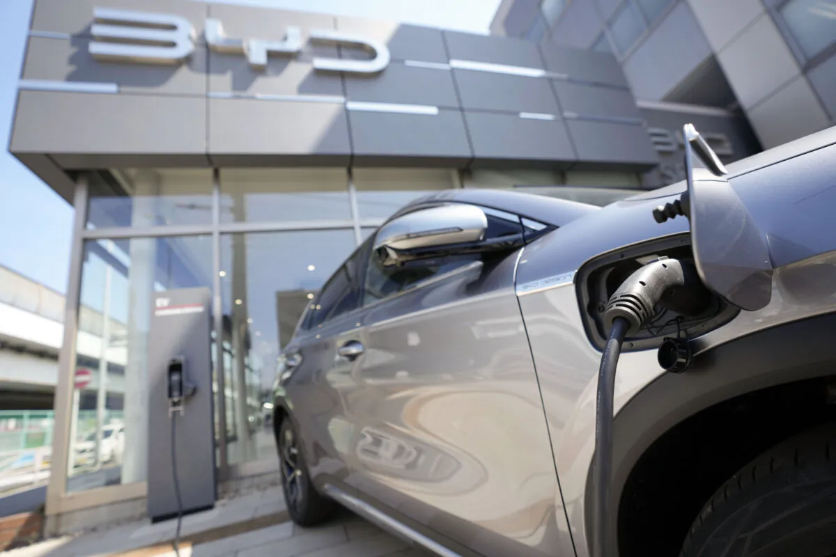 A BYD ATTO 3 electric sports utility vehicle gets charged while on display at a BYD dealership in Yokohama, Japan, on April 4, 2023. (Eugene Hoshiko /AP Photo)