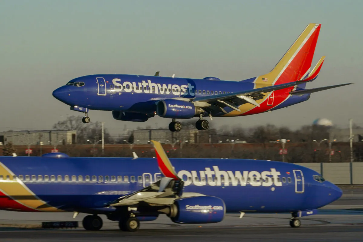 Southwest Airlines plane prepares to land at Midway International Airport, Feb. 12, 2023, in Chicago. Flight attendants at Southwest Airlines on Wednesday, April 24, 2024, ratified a contract that includes pay raises totaling more than 33% over four years, as airline workers continue to benefit from the industry's recovery since the pandemic. (AP Photo/Kiichiro Sato)