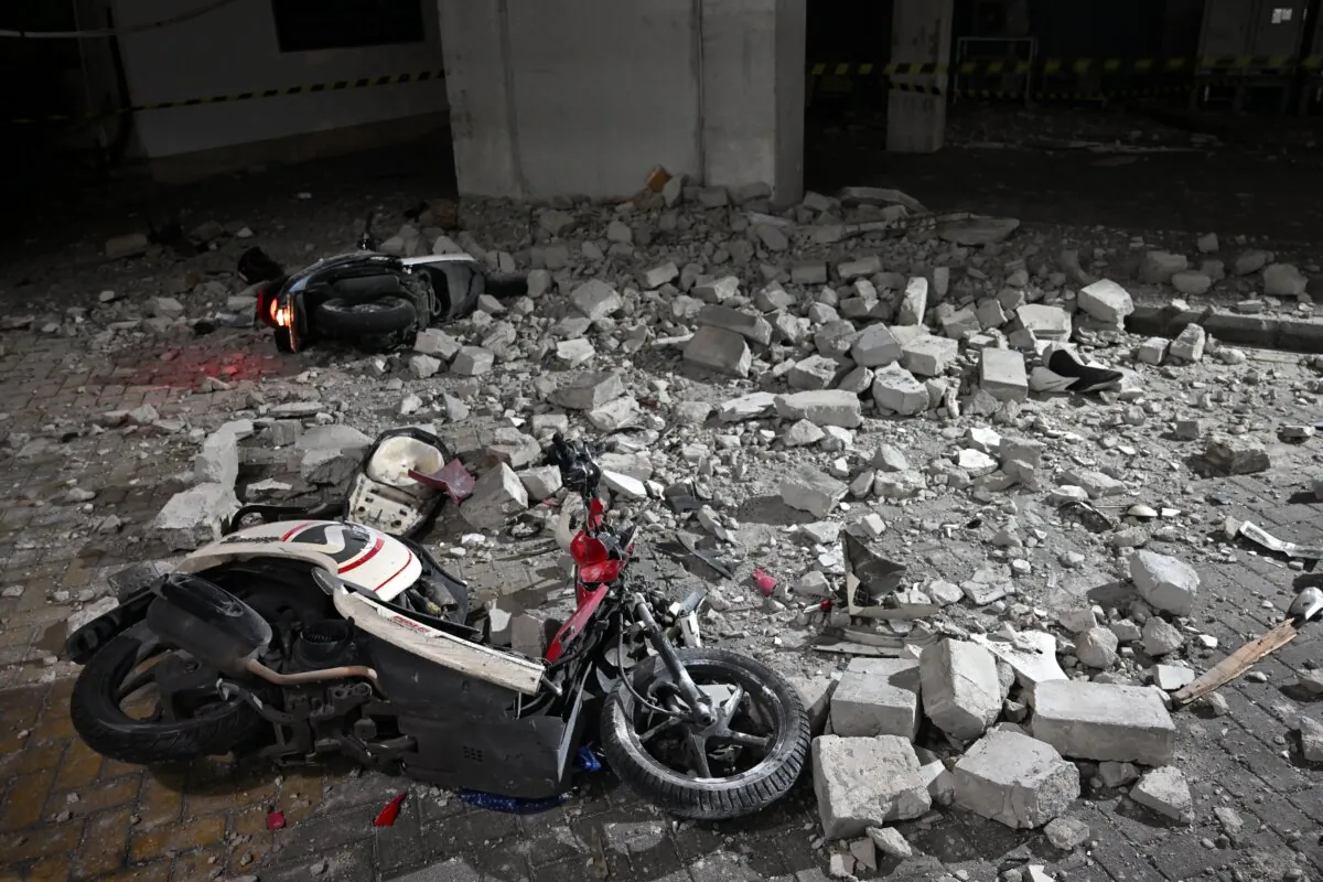 Damaged scooters hit by debris lay at a parking after a magnitude-6.4 offshore earthquake hit near Indonesia's Java island, at Airlangga university hospital in Surabaya on March 22, 2024. (Juni Kriswanto/AFP via Getty Images)