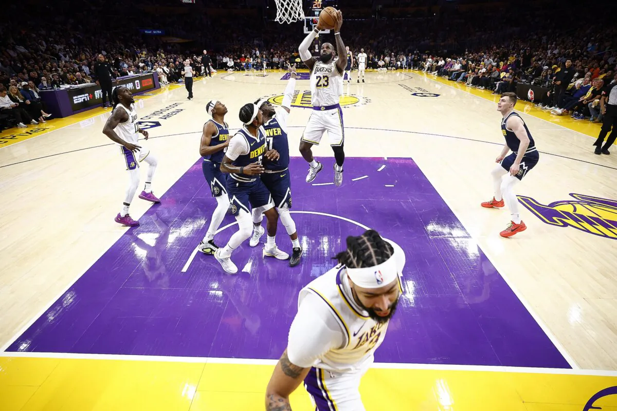 LeBron James (23) of the Los Angeles Lakers takes a shot against the Denver Nuggets in the first half during game four of the Western Conference First Round Playoffs  in Los Angeles on April 27, 2024. (Ronald Martinez/Getty Images)