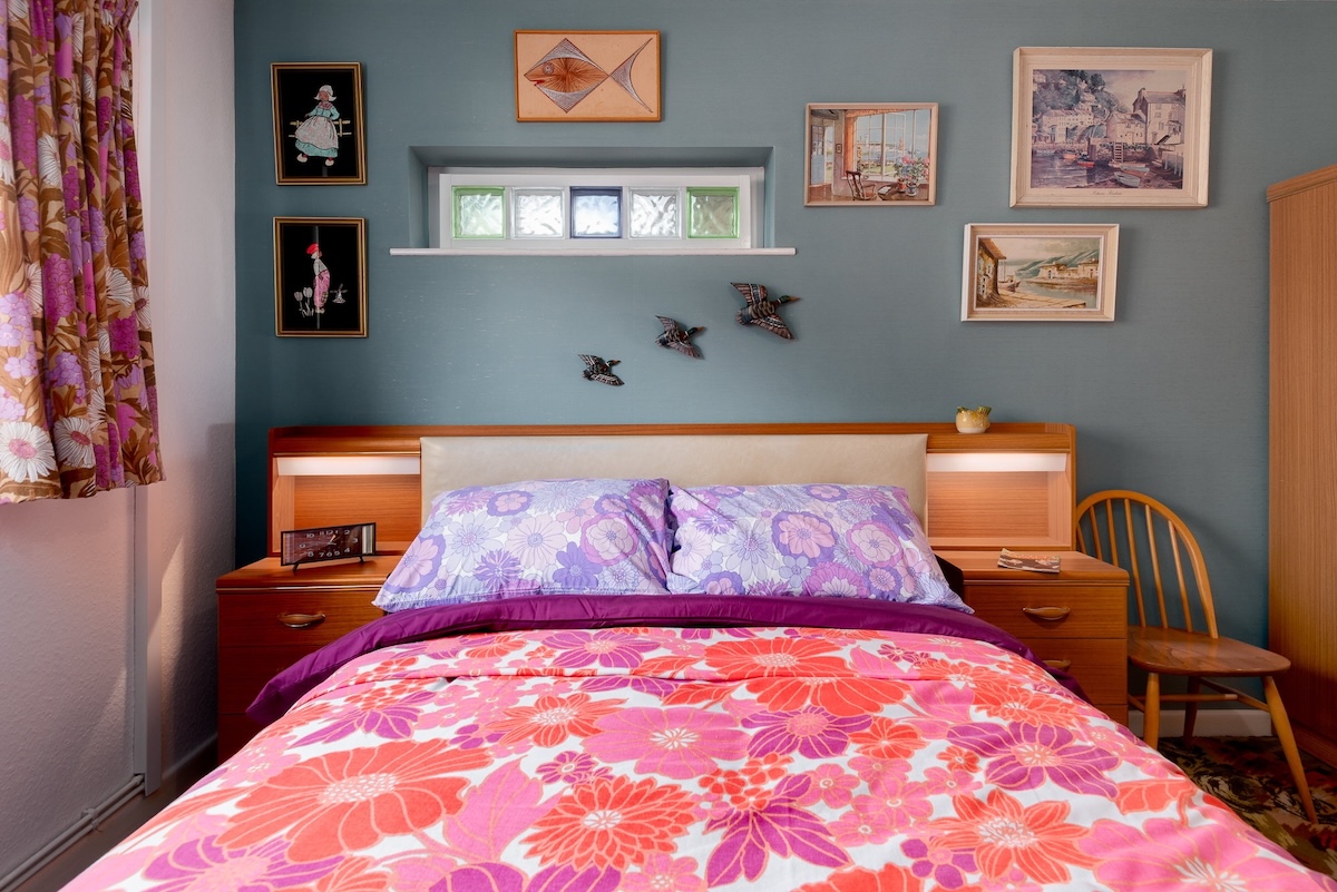 The bedroom boats vibrant colors.