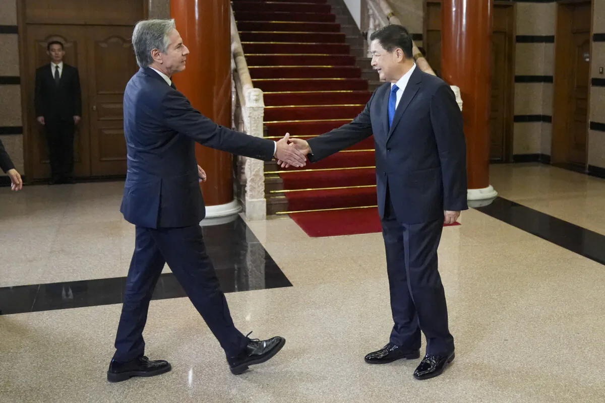U.S. Secretary of State Antony Blinken (L) shakes hands with China's Minister of Public Security Wang Xiaohong before their meeting at the Diaoyutai State Guesthouse in Beijing on April 26, 2024. (Mark Schiefelbein/POOL/AFP via Getty Images)