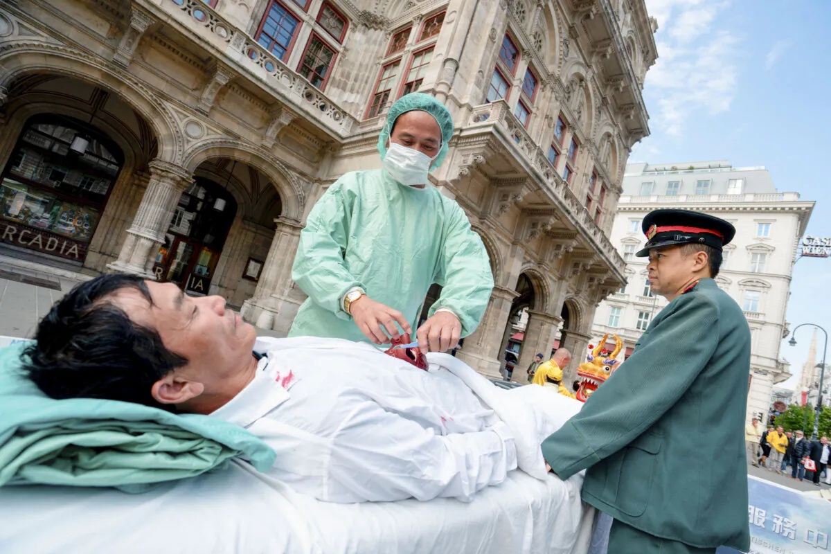 Up to 300 supporters of the practice of Falun Dafa march through the city center of Vienna, Austria, to protest against the importing of stolen human organs from China to Austria, on Oct. 1, 2018. (Joe Klamar/AFP via Getty Images)