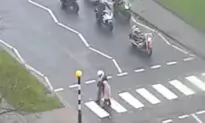 Biker Helps Older Lady Cross a Road