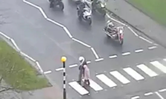 Biker Helps Older Lady Cross a Road