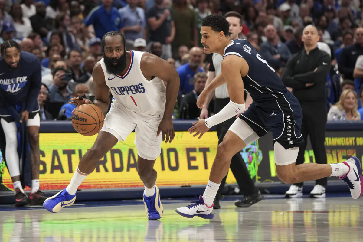 James Harden of the Los Angeles Clippers drives past the Dallas Mavericks' Josh Green during NBA playoff action in Dallas on April 28, 2024. (Jeffrey McWhorter/AP Photo)