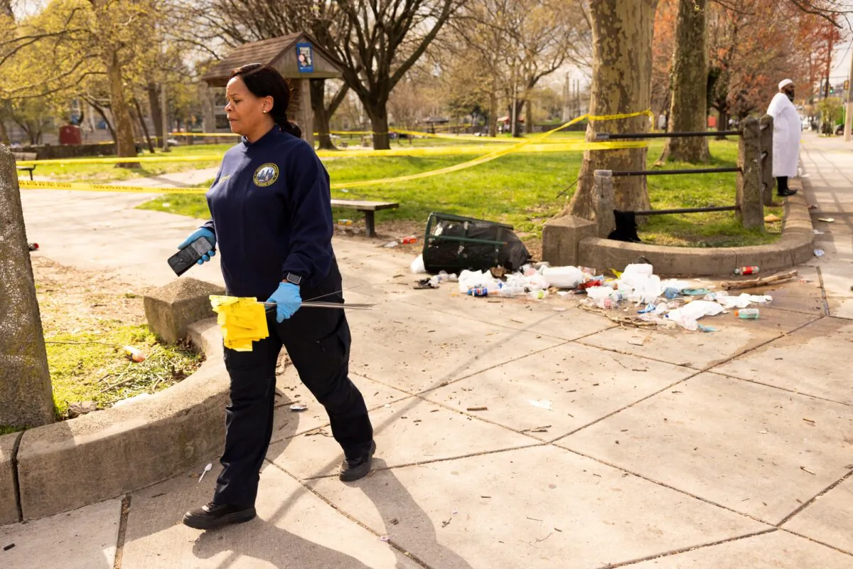 A member of the crime scene unit marks shell casings after a shooting in Clara Muhammad Square during an Eid celebration in Philadelphia, Pa., on April 10, 2024. (Ryan Collerd/AFP via Getty Images)