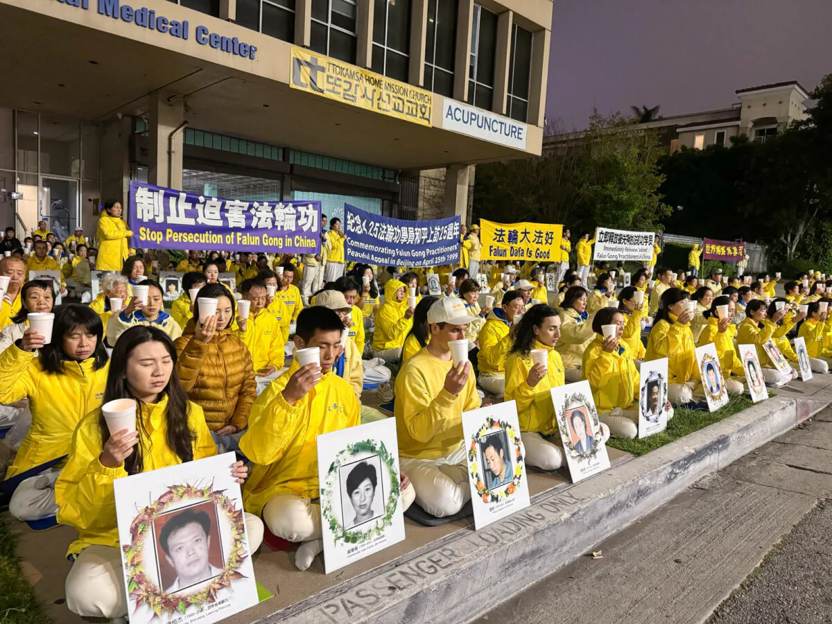 Falun Gong adherents hold a candlelight vigil in front of the Chinese Consulate to mark the 25th anniversary of a peaceful appeal by 10,000 people in China, in Los Angeles on April 21, 2024. (Linda Jiang/The Epoch Times)
