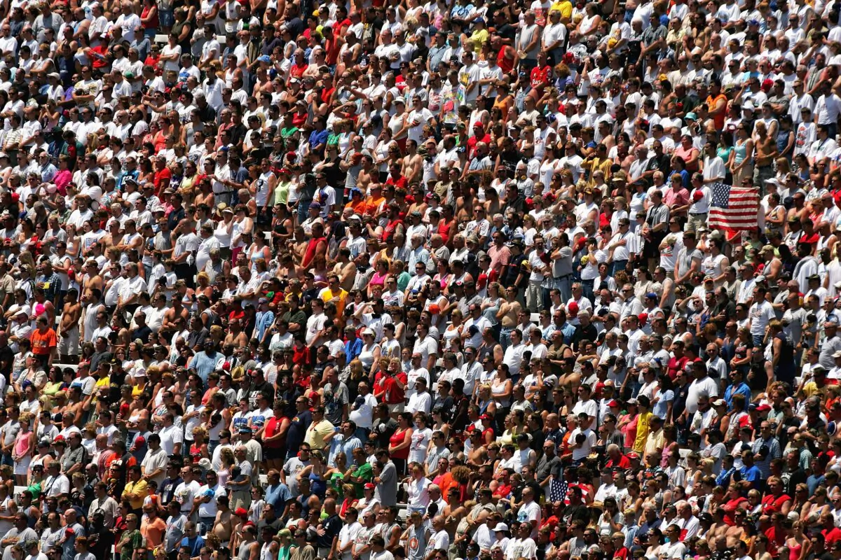 Fans stand for the National Anthem before the NASCAR Nextel Cup MBNA RacePoints 400 at the Dover International Speedway in Dover, Del., on June 5, 2005. (Ezra Shaw/Getty Images)