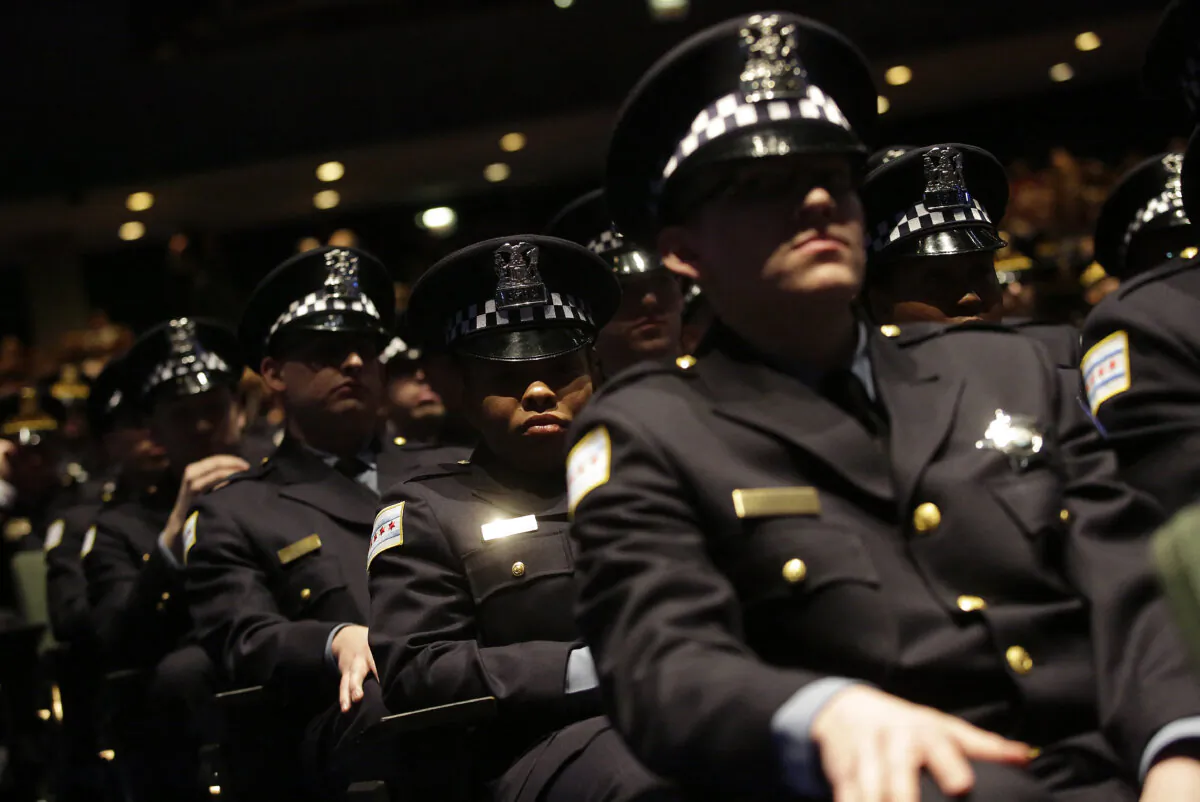 New Chicago Police Department officers attend their graduation ceremony in Chicago on March 15, 2017. (Joshua Lott/AFP via Getty Images)