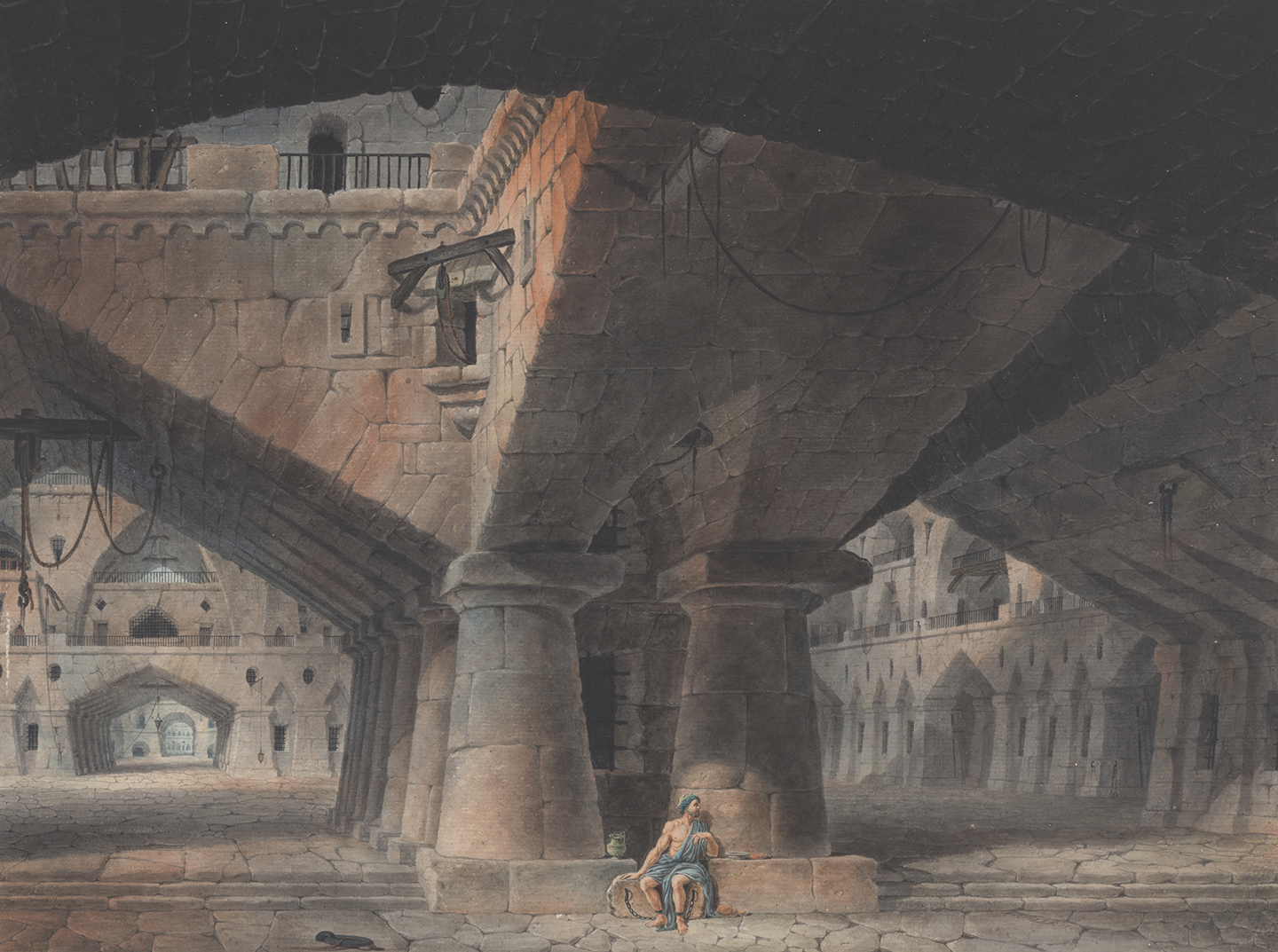 Man Seated in Prison
