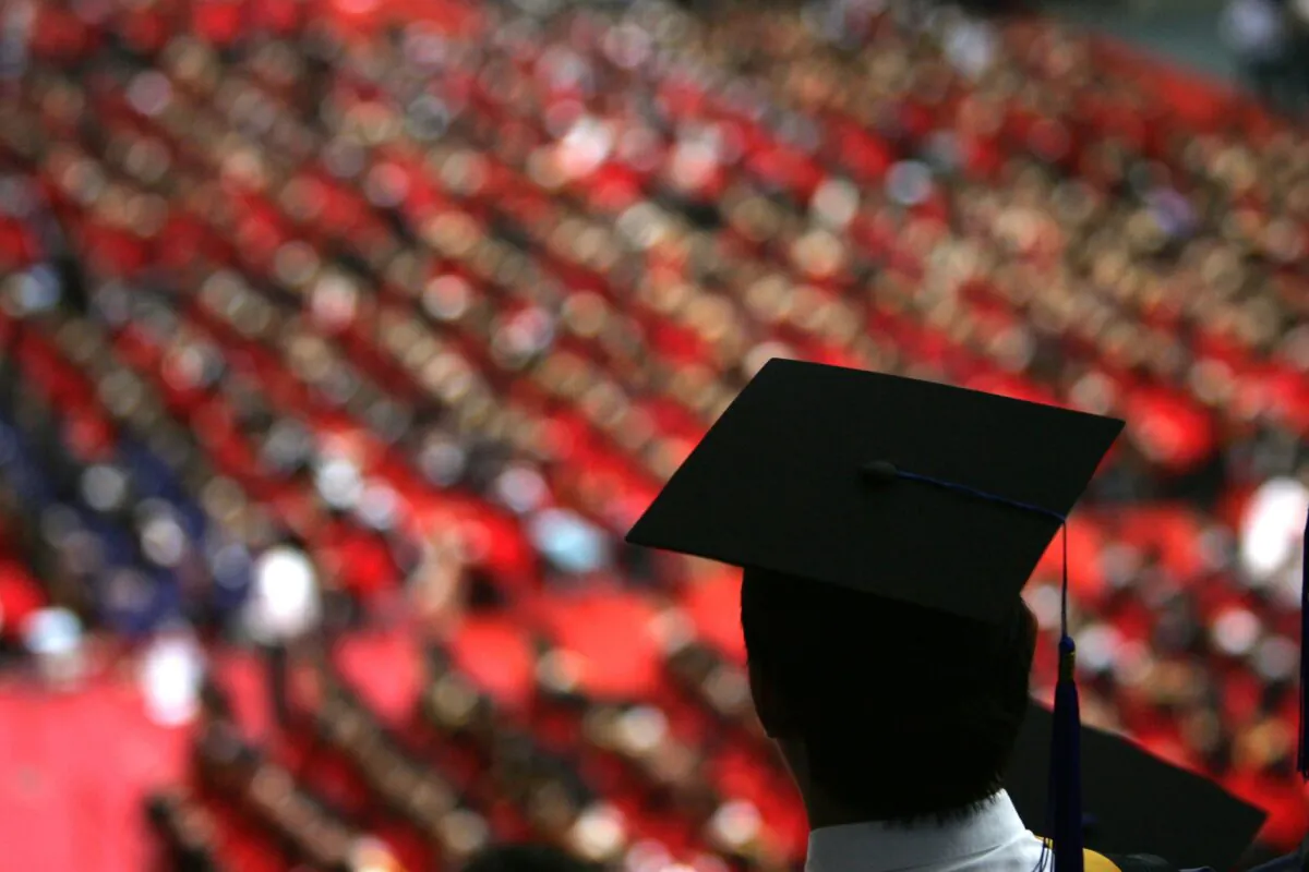 Graduates during a ceremony held for 3,768 master and 898 doctoral candidates at Tsinghua University, in Beijing, on July 18, 2007. (China Photos/Getty Images) 
