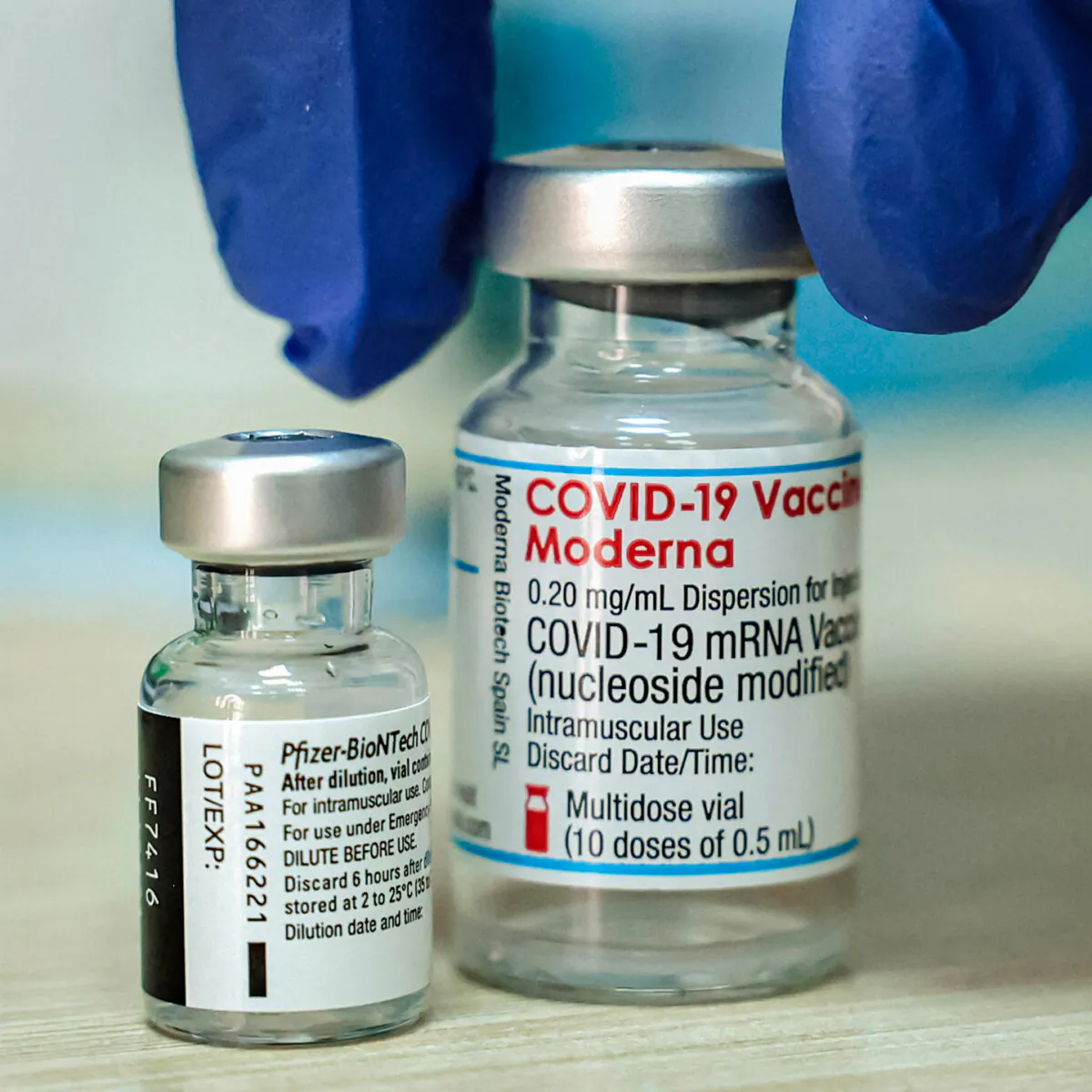 A medic prepares two vials of COVID-19 vaccines. (Hazem Bader/AFP via Getty Images)
