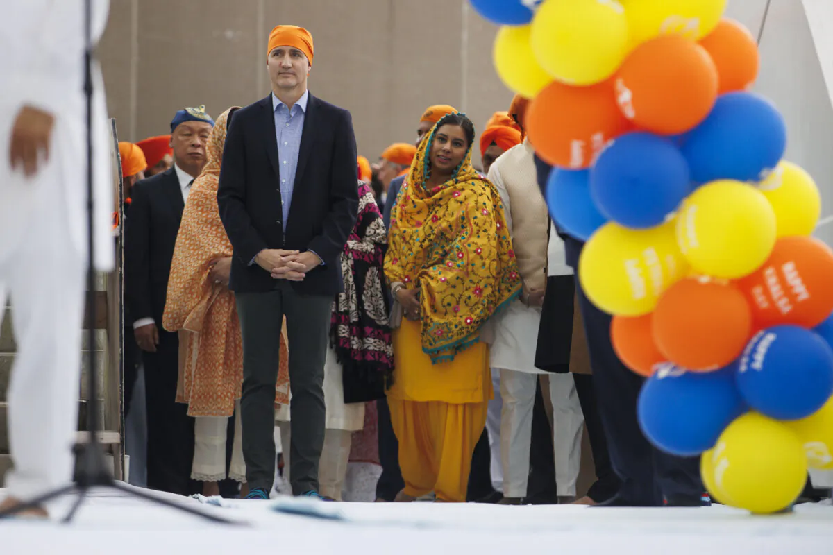 Prime Minister Justin Trudeau waits to speak to a crowd during Khalsa Day celebrations at City Hall in Toronto on April 28, 2024. (Cole Burston/The Canadian Press)