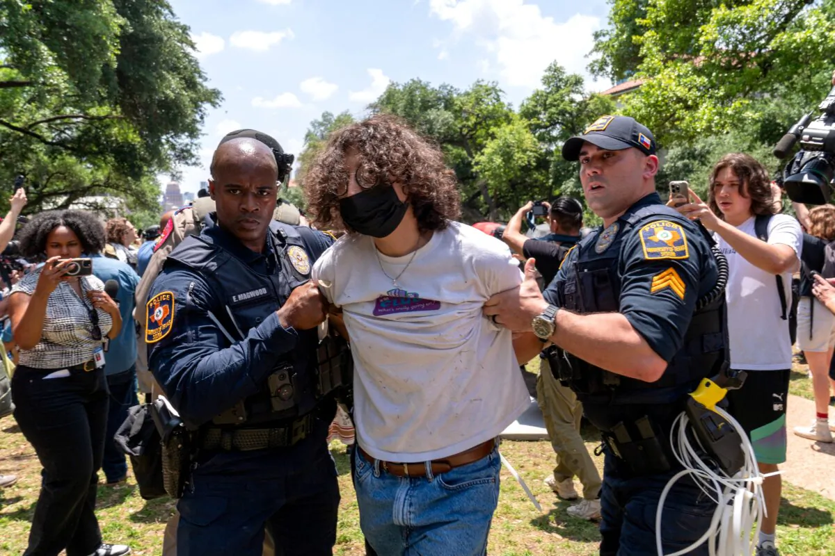 Texas University policemen arrest a pro-Palestinian protestor at the University of Texas in Austin on April 29, 2024. (Suzanne Cordeiro/AFP via Getty Images)