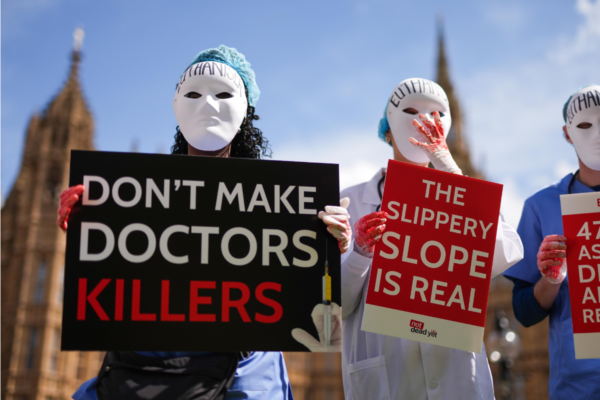 Campaigners protest outside Parliament in Westminster, London, ahead of a debate in the House of Commons on assisted dying on April 29, 2024. (Jordan Pettitt/PA Wire)