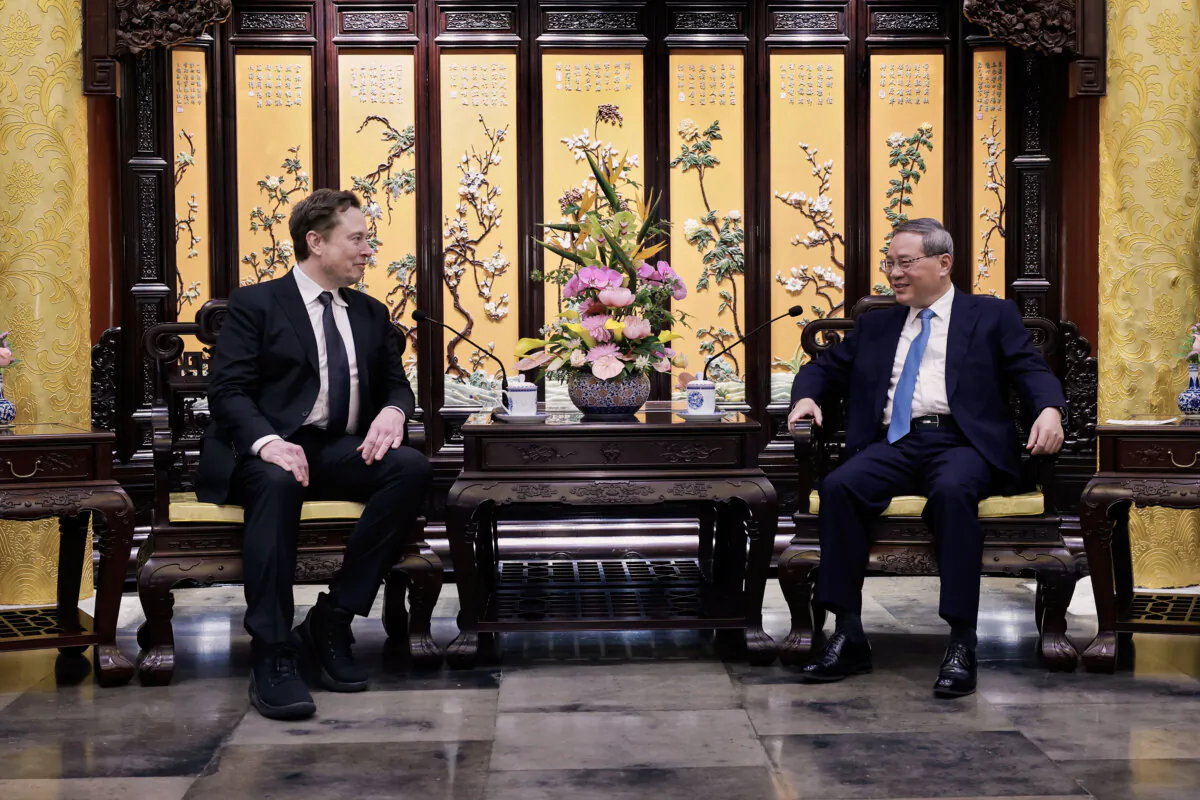 Tesla founder and CEO Elon Musk (L) meets with China's Li Qiang (R) in Beijing on April 28, 2024. (Wang Ye/Xinhua via AP)