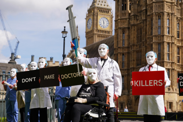Campaigners protest outside Parliament ahead of a debate in the House of Commons on assisted dying in Westminster, London, on April 29, 2024. (Jordan Pettitt/PA Wire)