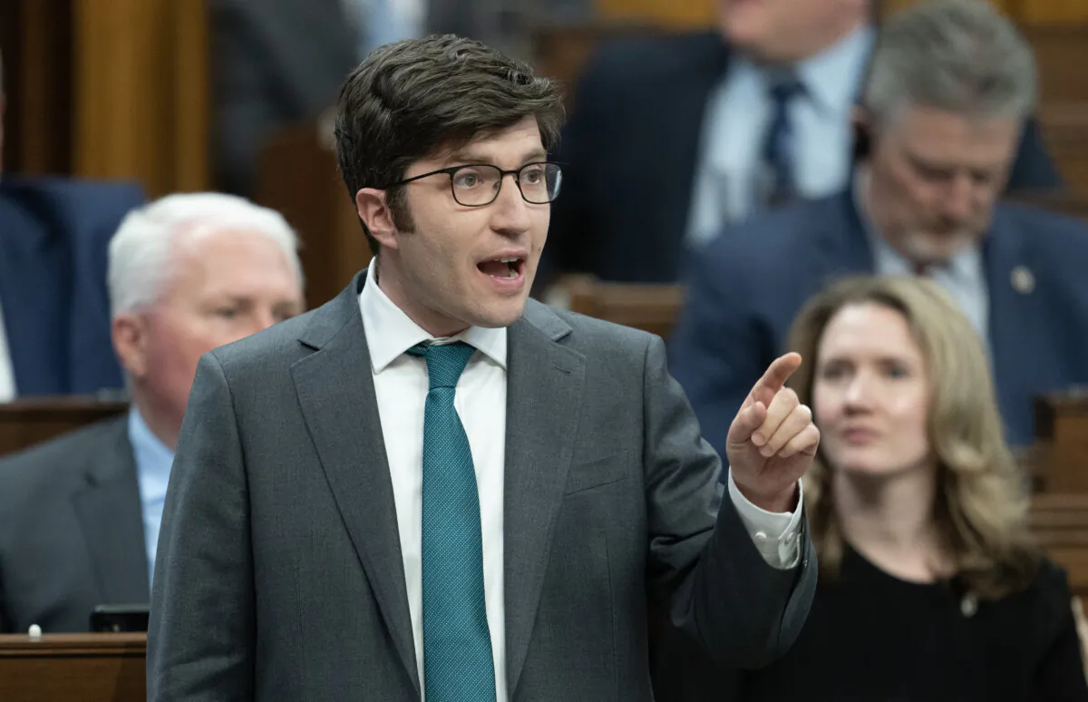 Conservative MP for Sherwood Park-Fort Saskatchewan Garnett Genuis rises during question period in the House of Commons on April 15, 2024. (Adrian Wyld/The Canadian Press)