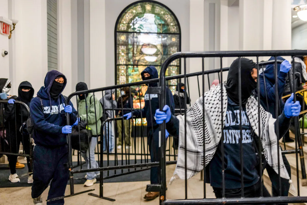 Demonstrators supporting Palestinians in Gaza barricade themselves inside Hamilton Hall, an academic building which has been occupied in past student movements, in New York on April 30, 2024. (Alex Kent/Getty Images)