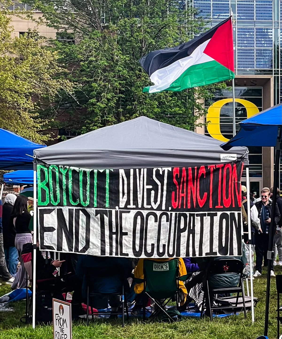 Students encamped at the University of Oregon campus in Eugene demand the university boycott and divest from Israel on April 30, 2024. (Scottie Barnes)