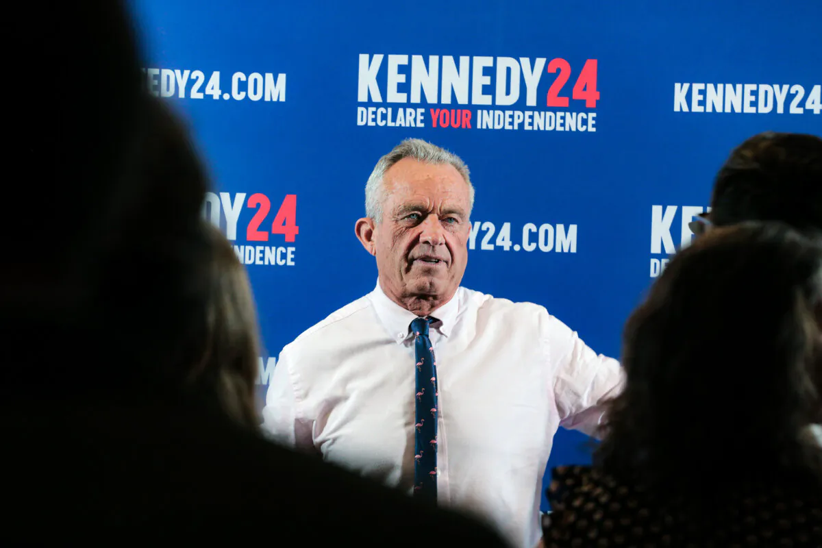 Robert F. Kennedy Jr. meets with reporters after a voter rally in Holbrook, N.Y., on April 28, 2024. (Richard Moore/The Epoch Times)