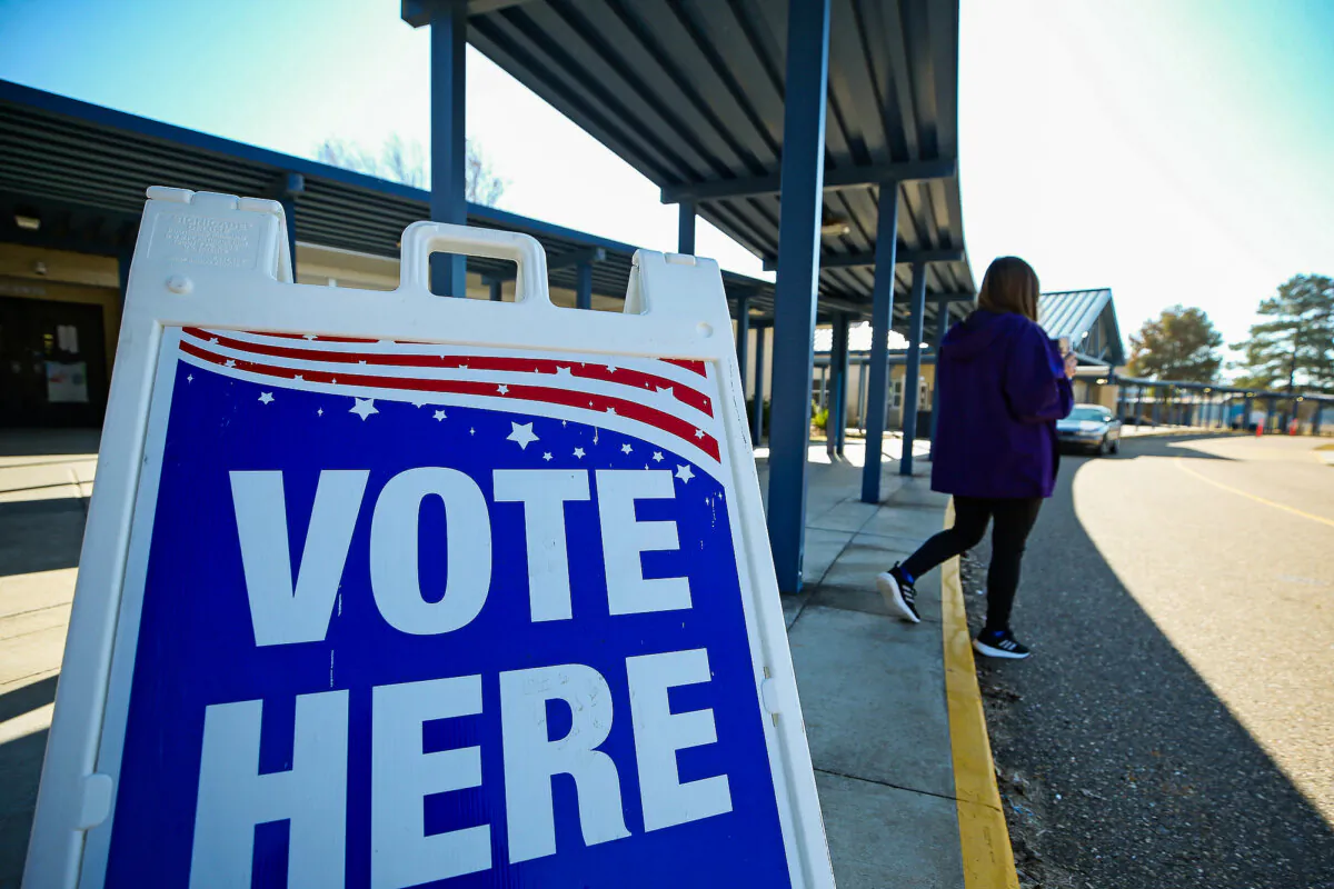 Sign at a runoff election for Louisiana governor at a polling station at Quitman High School in Quitman, La., on Nov. 16, 2019. (Matt Sullivan/Getty Images)