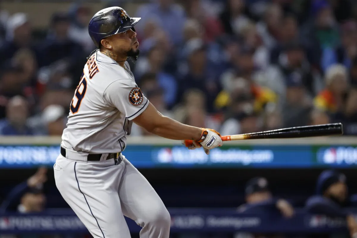 Jose Abreu (79) of the Houston Astros hits a two-run home run against the Minnesota Twins during the fourth inning in Game Four of the Division Series at Target Field in Minneapolis on Oct. 11, 2023. (David Berding/Getty Images)