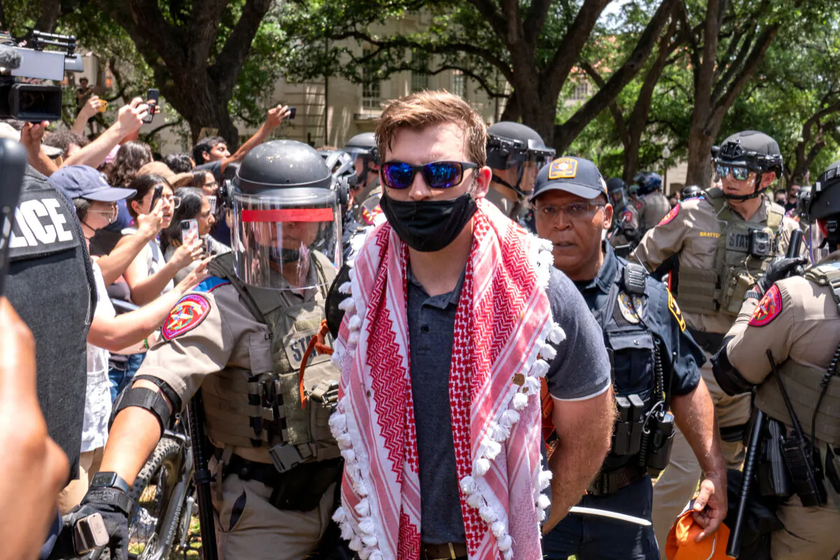 A pro-Palestinian protestor is arrested by Texas State Troopers at the University of Texas in Austin, Texas, on April 29, 2024. (Suzanne Cordeiro/AFP via Getty Images)