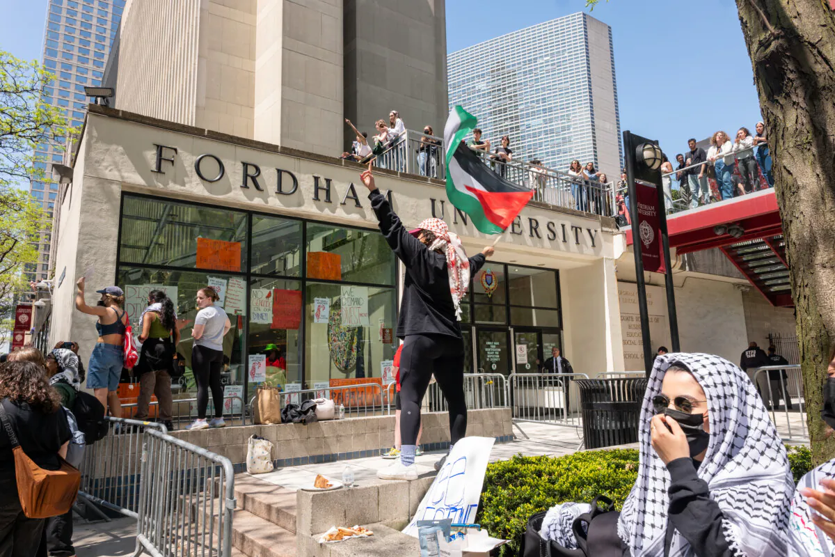Pro-Palestinian protesters gather outside Fordham's Lincoln Center campus after a group created an encampment inside the building in New York City on May 1, 2024. (Spencer Platt/Getty Images)