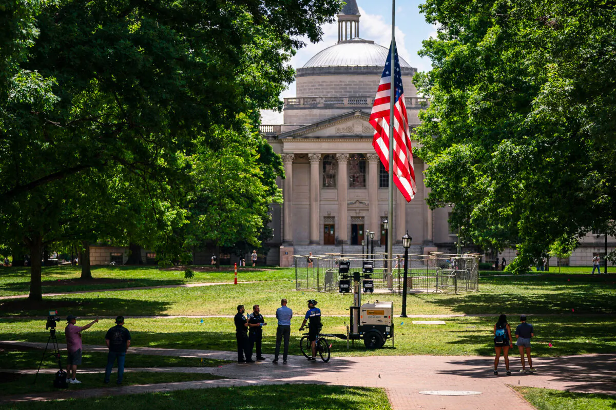 A barricade protects the American flag at Polk Place at the University of North Carolina in Chapel Hill, on May 1, 2024. (Sean Rayford/Getty Images)