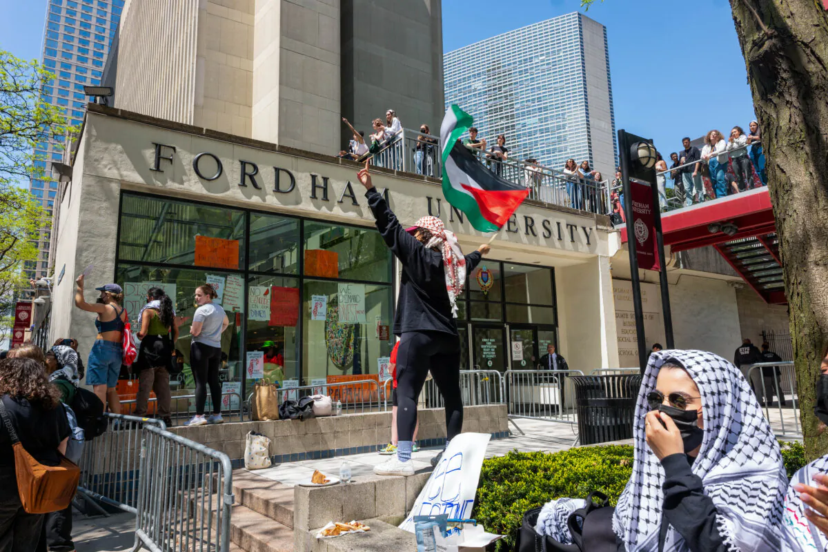Pro-Palestinian protesters gather outside Fordham's Lincoln Center campus after a group created an encampment inside the building in New York City on May 1, 2024. (Spencer Platt/Getty Images)