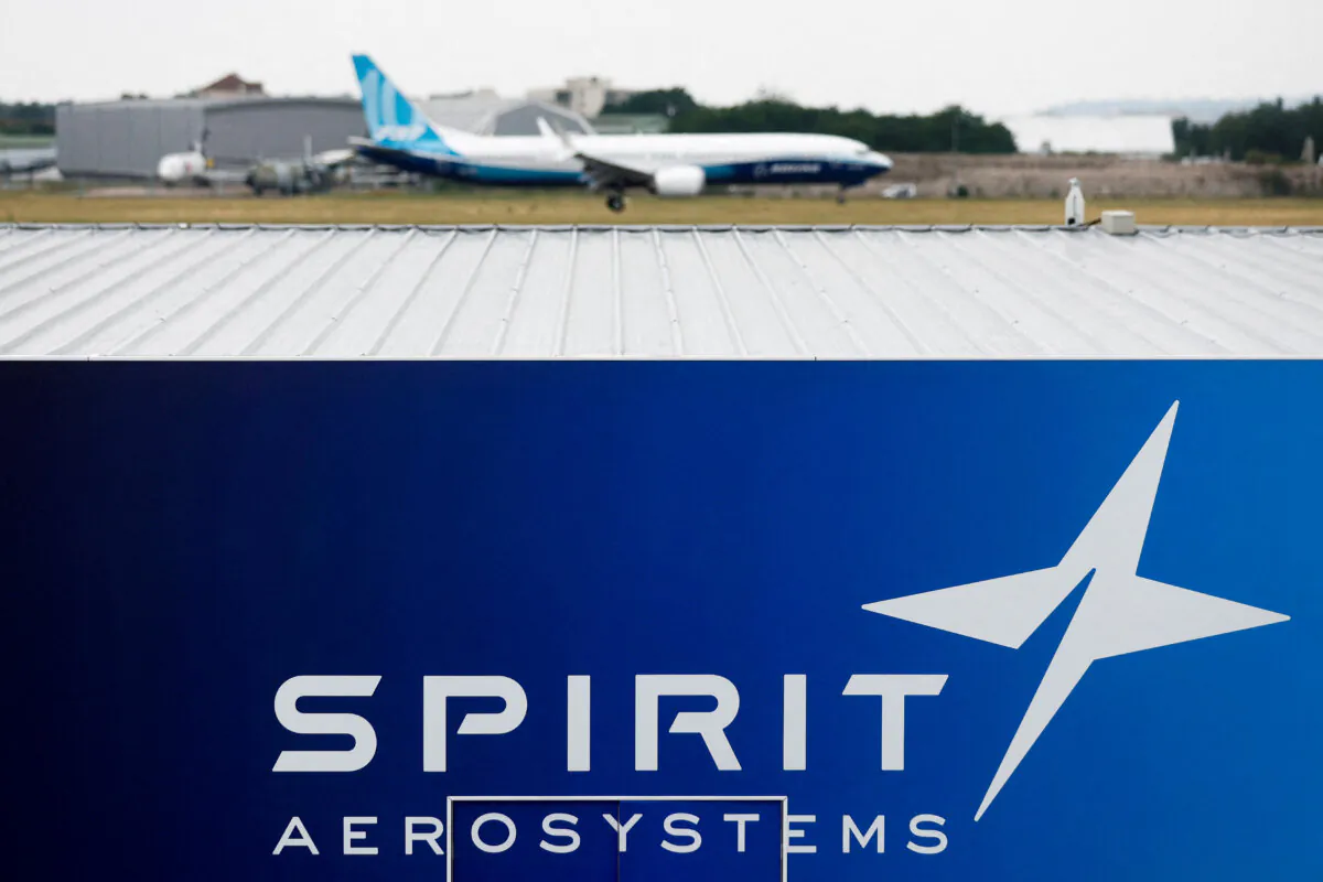 A Boeing 737 MAX-10 lands over the Spirit AeroSystems logo during a flying display at the 54th International Paris Air Show at Le Bourget Airport near Paris on June 22, 2023. (Benoit Tessier/Reuters)
