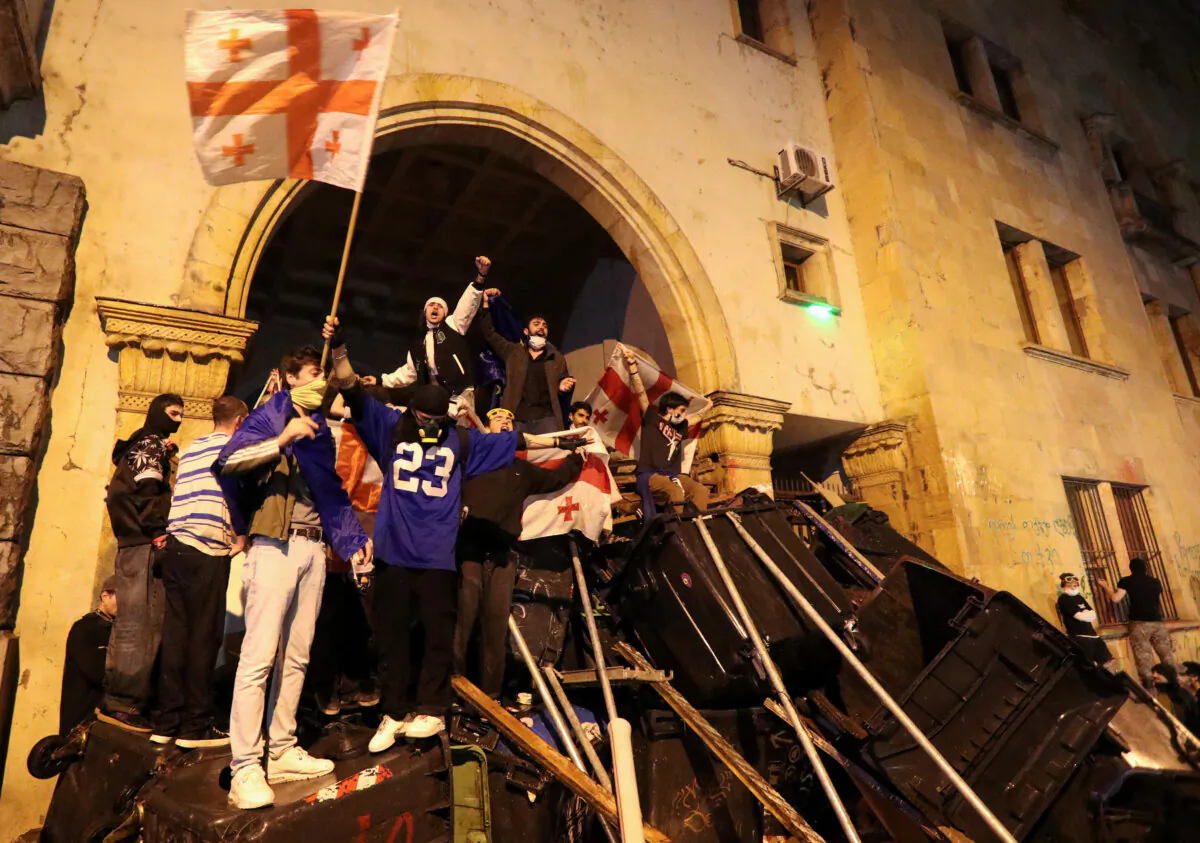 Protesters barricade the entrance of Parliament during a rally to protest against a bill on "foreign agents", in Tbilisi, Georgia, May 2, 2024. (Irakli Gedenidze/REUTERS)