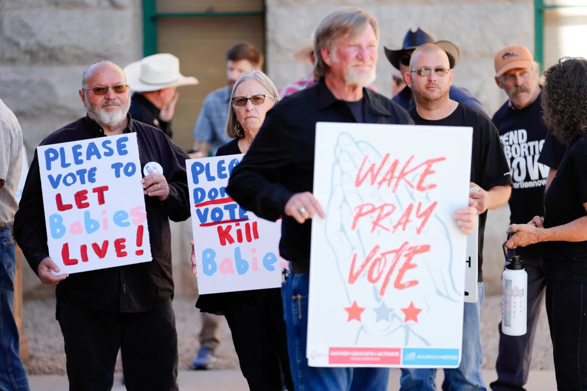Pro-life supporters stand outside at the Airzona Capitol in Phoenix, on May 1, 2024. (Matt York/AP Photo)