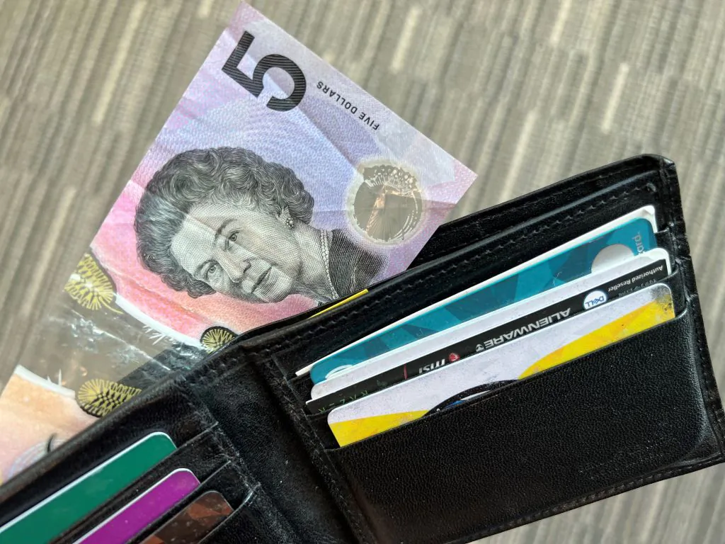 This photo illustration taken in Hong Kong on February 2, 2023 shows the Australian $5 banknote. - Australia's central bank announced on February 2, 2023 it will erase the British monarch from its banknotes, replacing the late Queen Elizabeth II's image on its $5 note with a design honouring Indigenous culture. (Photo by Mladen ANTONOV / AFP) (Photo by MLADEN ANTONOV/AFP via Getty Images)