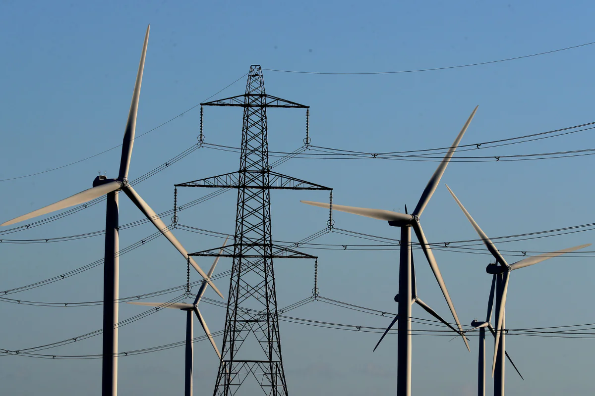 A view of the Little Cheyne Court Wind Farm amongst existing electricity pylons on the Romney Marsh in Kent, England, on Dec. 28, 2017. (Gareth Fuller/PA Wire)