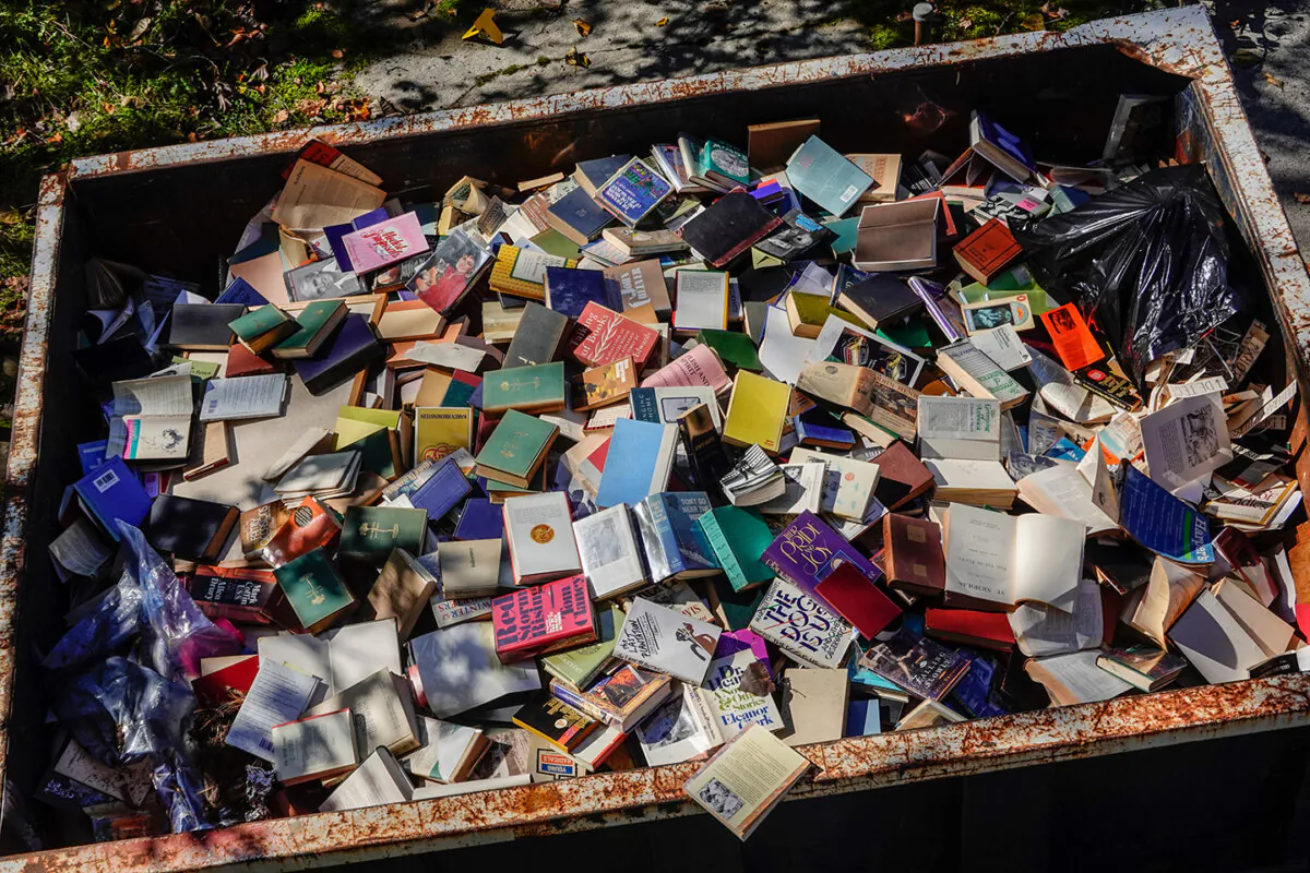 A dumpster filled with discarded books from an old bookstore in West Cornwall, Ct. (Alexanderstock23/Shutterstock)