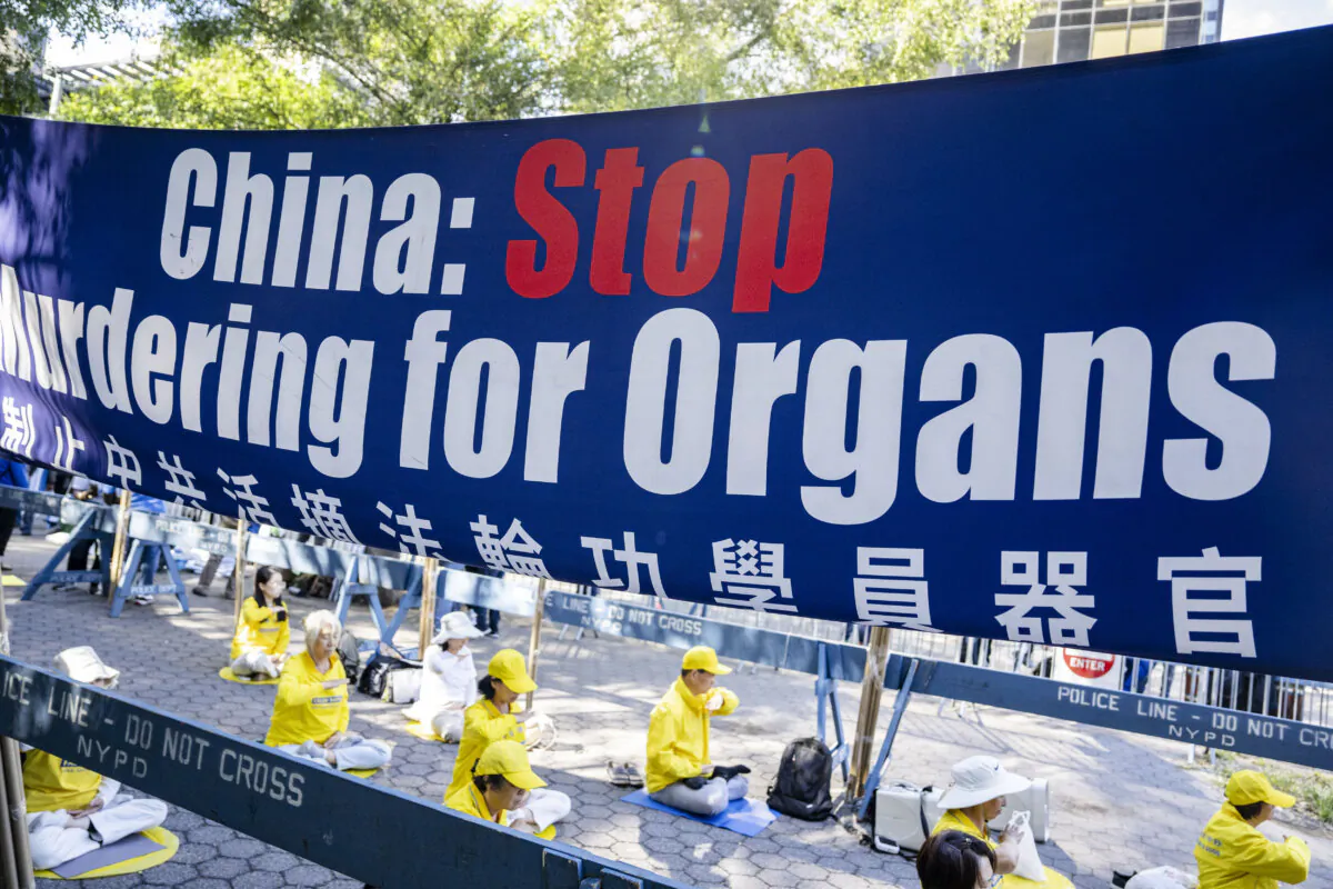 Falun Gong practitioners appeal next to the United Nations headquarters in New York City on Sept. 20, 2023. (Chung I Ho/The Epoch Times)