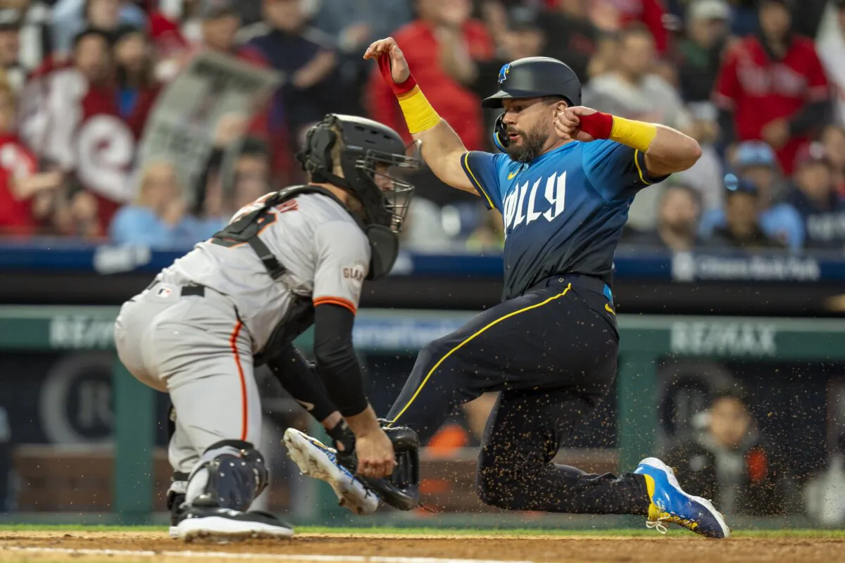 Philadelphia Phillies' Kyle Schwarber (R) slides into home to score a run before San Francisco Giants catcher Tom Murphy (L) could make the tag, during the third inning of a baseball game, in Philadelphia on May 3, 2024. (Chris Szagola/AP Photo)