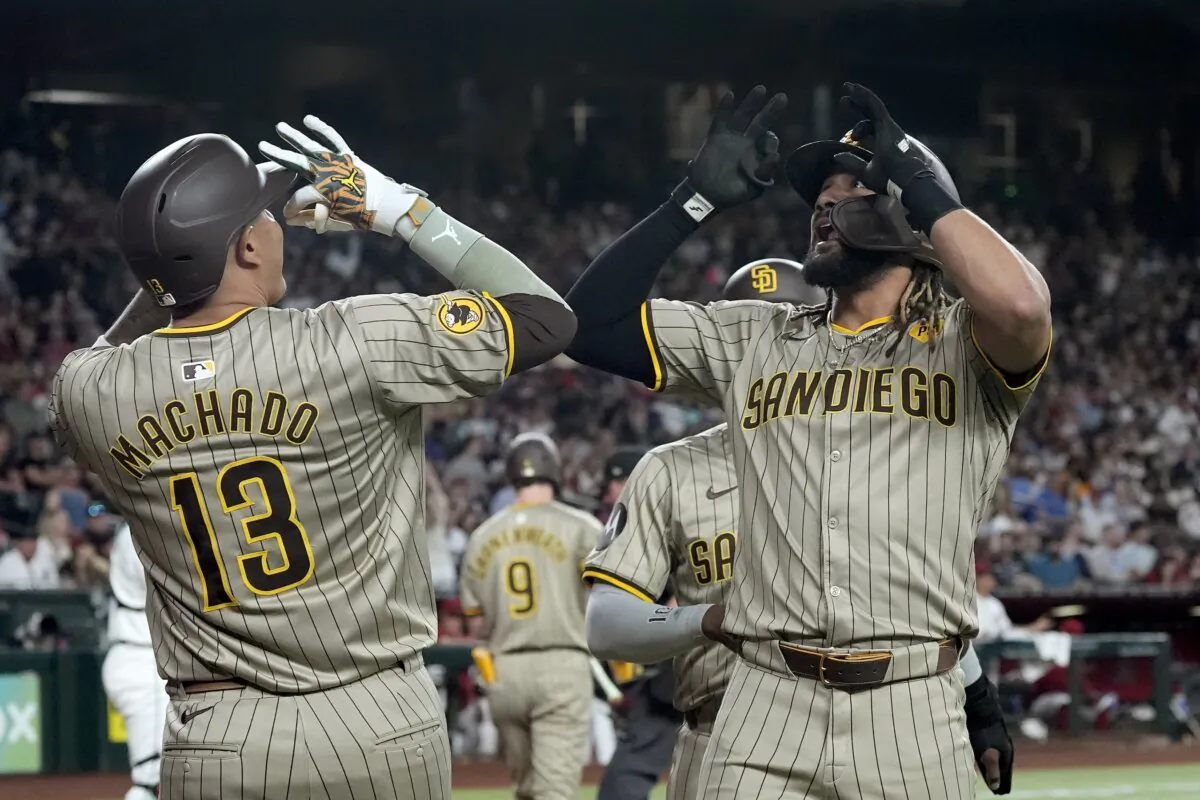 San Diego Padres' Fernando Tatis Jr. (R) celebrates his two-run home run against the Arizona Diamondbacks with Padres' Manny Machado (13) during the fourth inning of a baseball game in Phoenix on May 3, 2024. (Ross D. Franklin/AP Photo)