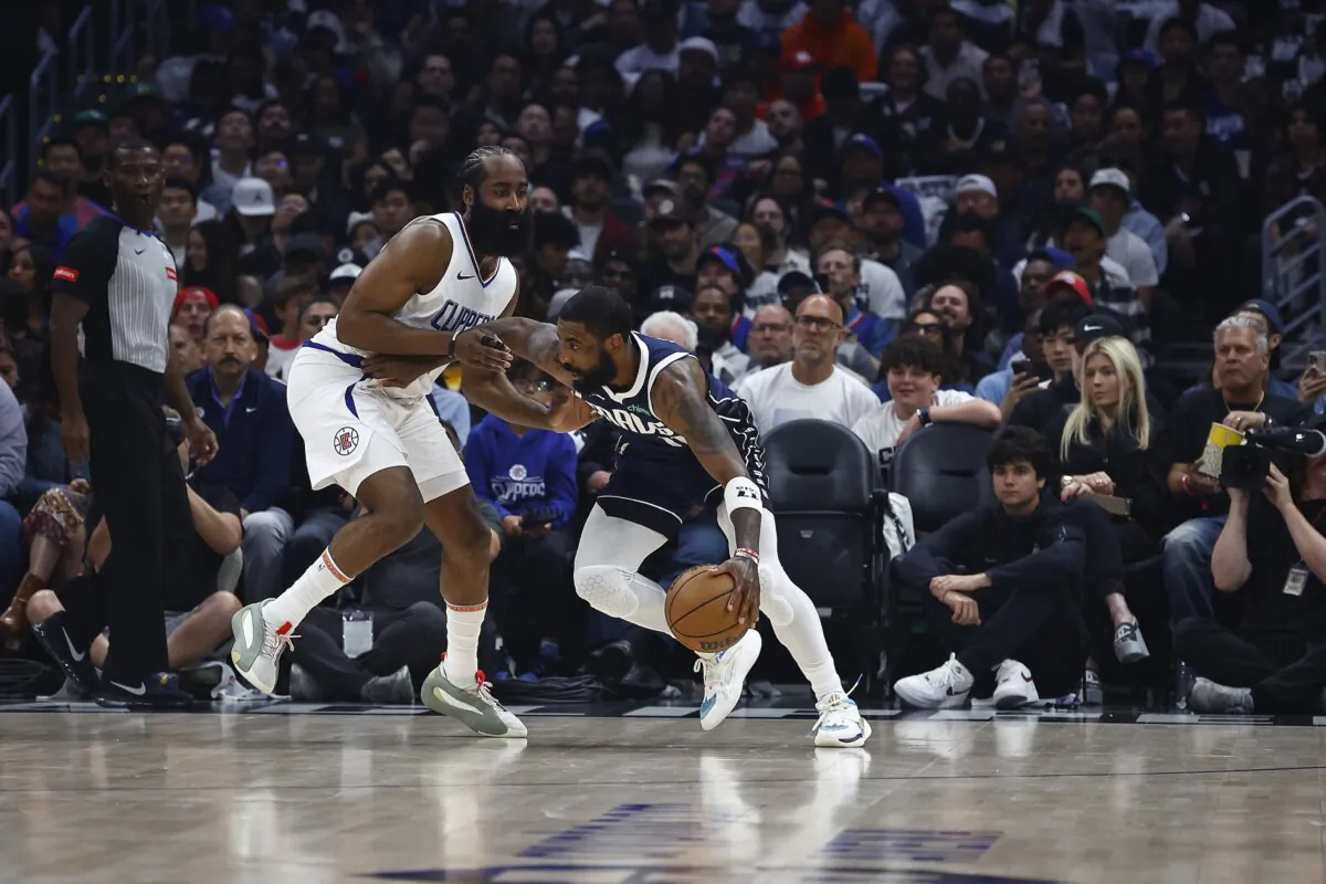James Harden (1) of the LA Clippers and Kyrie Irving (11) of the Dallas Mavericks during game five of the Western Conference First Round Playoffs in Los Angeles on May 1, 2024. (Ronald Martinez/Getty Images)