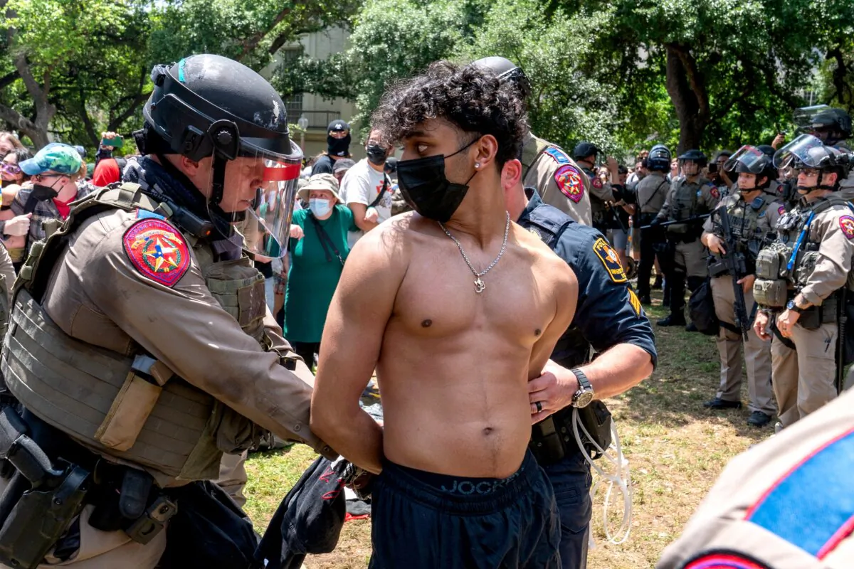 A pro-Palestinian protestor is arrested by Texas State Troopers at the University of Texas in Austin, Texas, on April 29, 2024. (Suzanne Cordeiro/AFP via Getty Images)