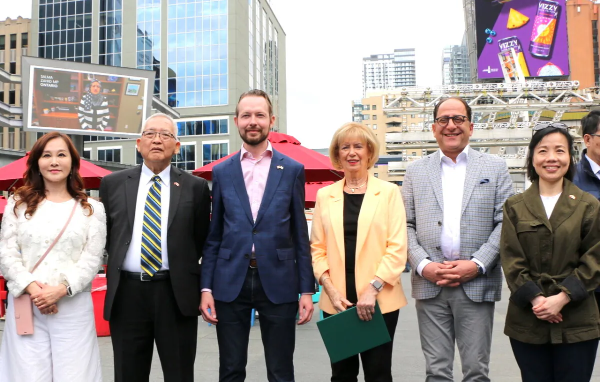 Liberal MPs Judy Sgro (4th L) and Ali Ehsassi (5th L) and Conservative MP Michael Cooper (3rd L) pose with Director General of the Taipei Economic and Cultural Office in Toronto (TECO) Jin-Ling Chen (R), and other representatives from TECO's Cultural Centre Maggie Lin (L) Peter Huang (1st L). They attended an event held at the Yonge-Dundas Square in downtown Toronto on May 4, 2024, to advocate for Taiwan's participation in the World Health Organization. (Andrew Chen/The Epoch Times)