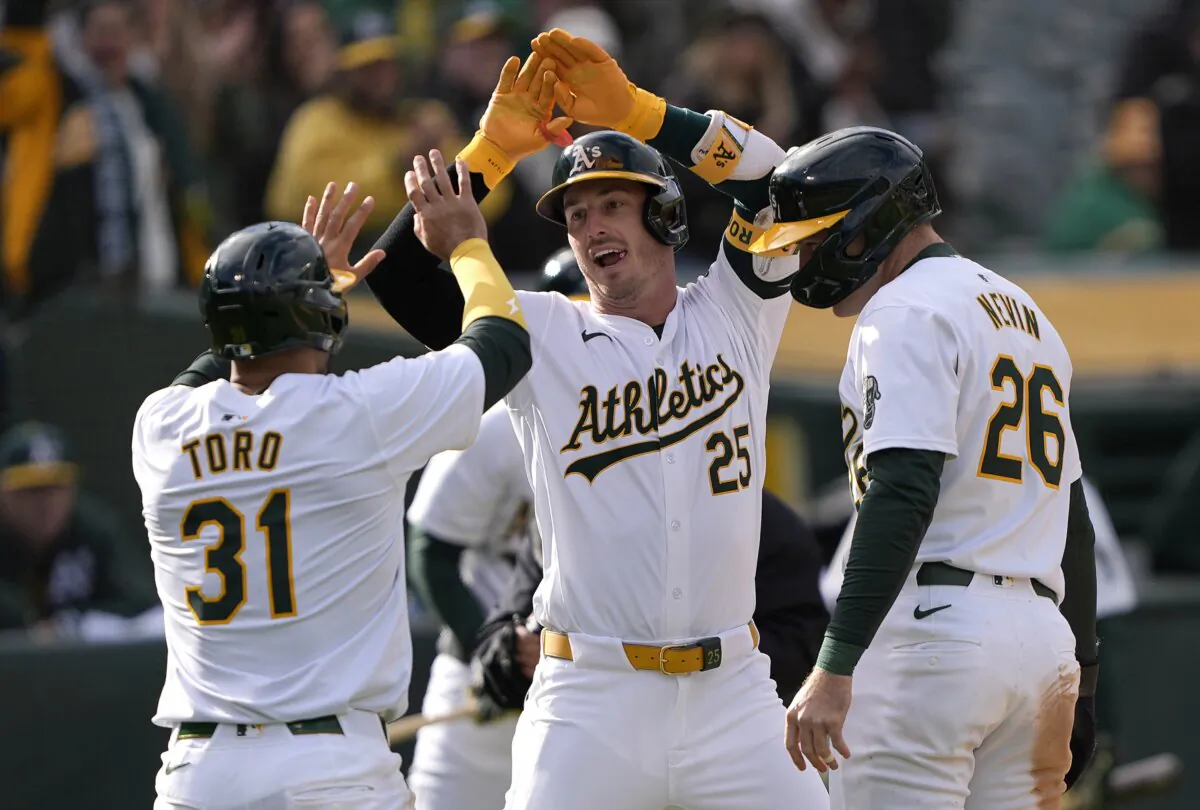 Brent Rooker (25) of the Oakland Athletics is congratulated by Abraham Toro (31) and Tyler Nevin (26) after Rooker hit a three-run home run against the Miami Marlins in the bottom of the third inning in Oakland. (Thearon W. Henderson/Getty Images)